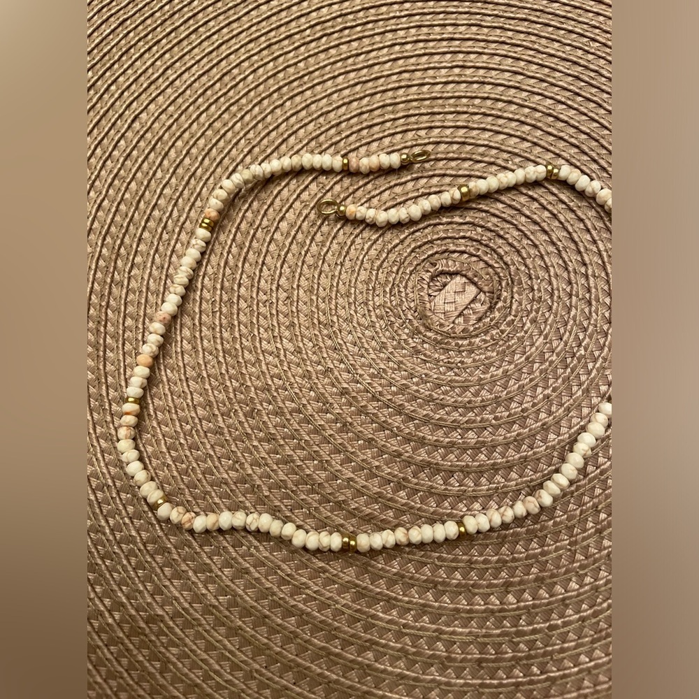 White turquoise bead necklace with gold filled open rings.